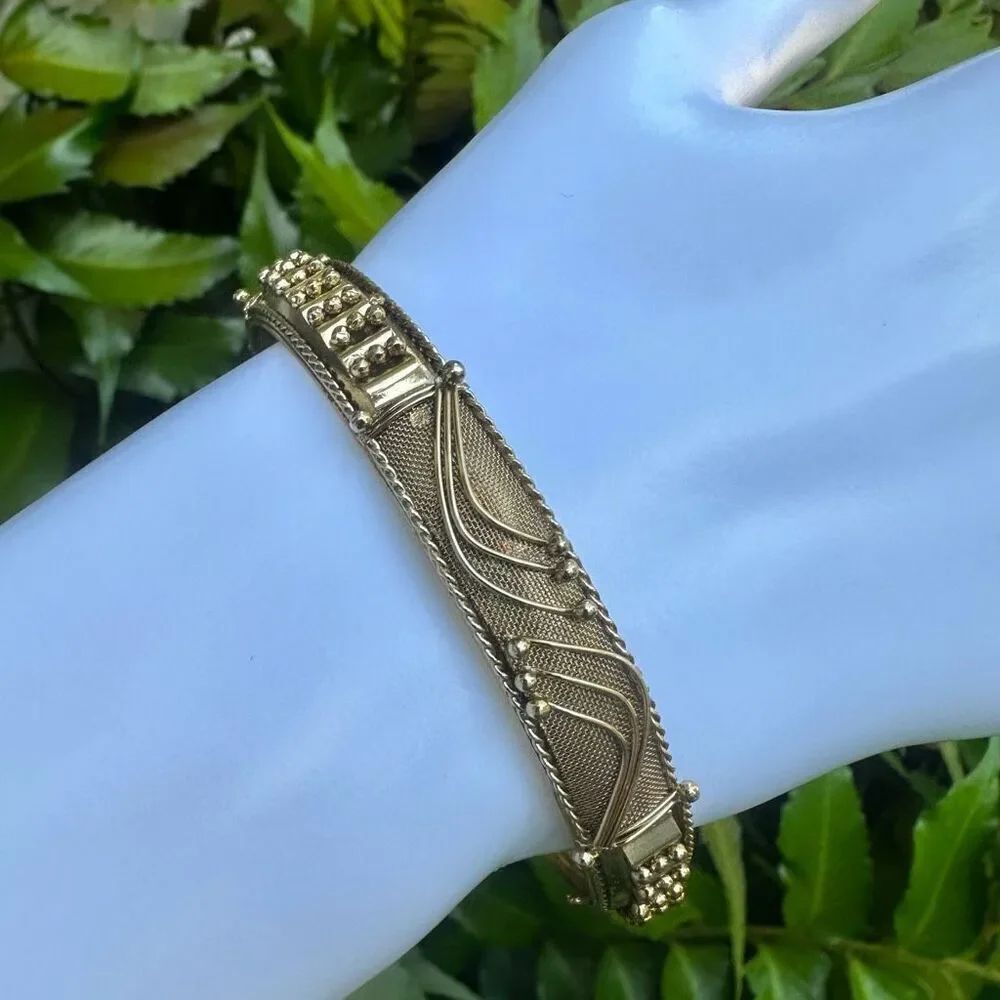 Gold tone ornate bangle bracelet